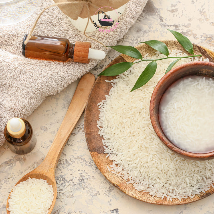 Rice soaking in water and small amber glass bottles